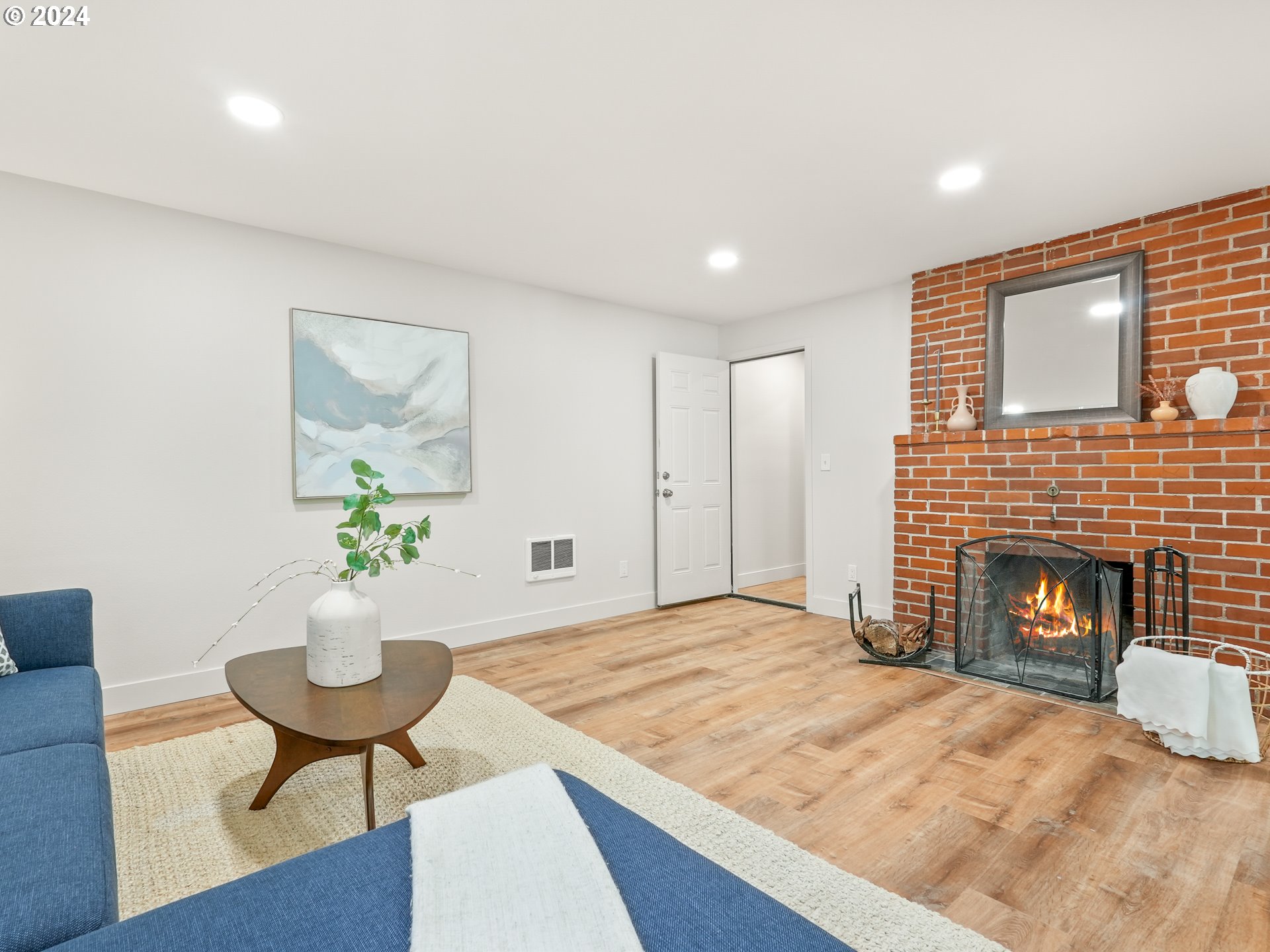 5525 Southwest Florida Street Portland, OR 97219 - Photo 29 of 44 a living room with furniture and a fireplace
