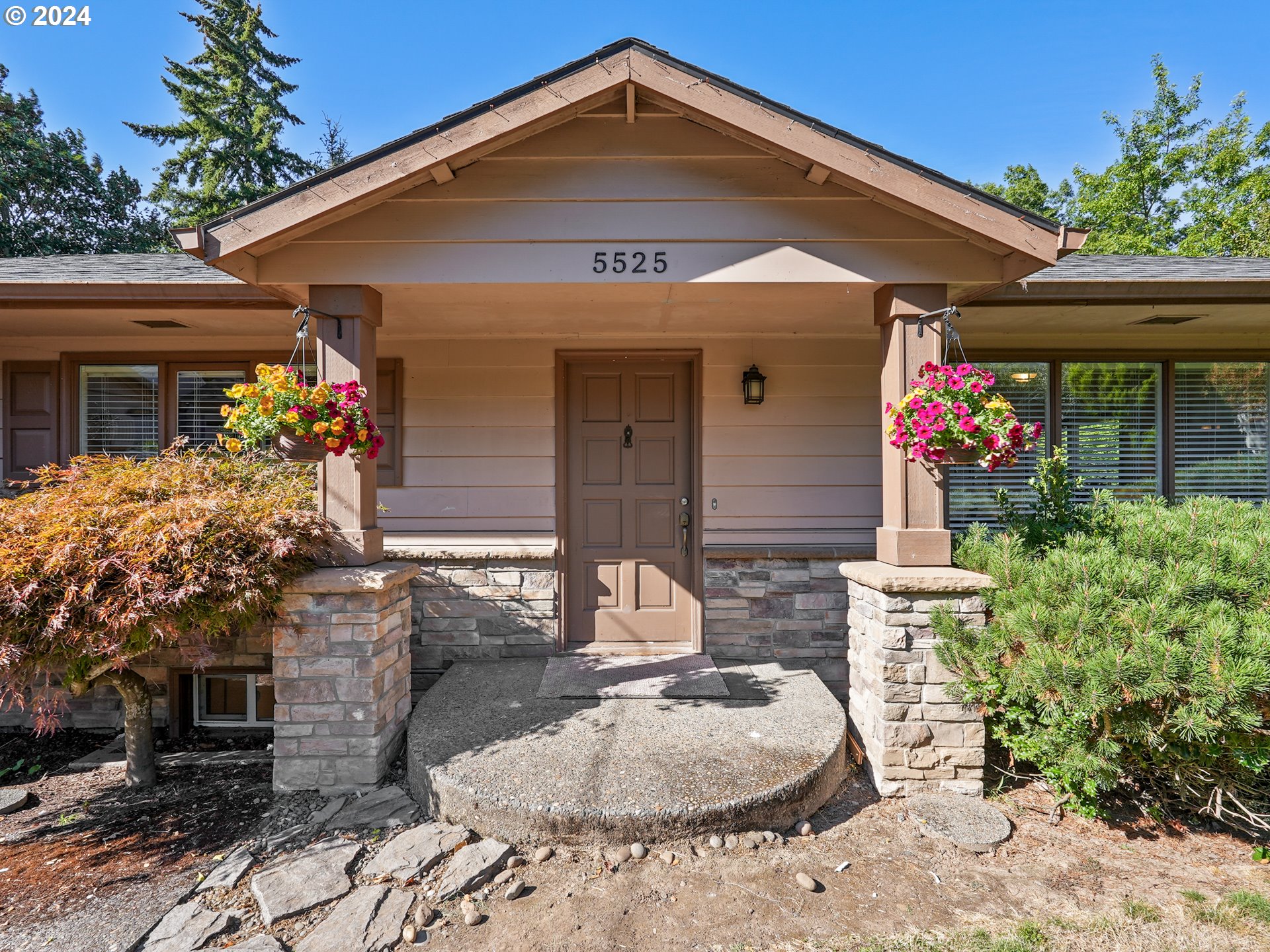5525 Southwest Florida Street Portland, OR 97219 - Photo 3 of 44 a front view of a house with a porch
