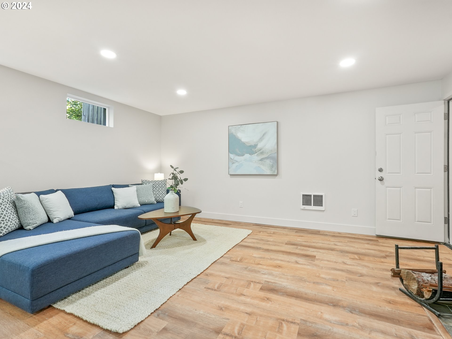 5525 Southwest Florida Street Portland, OR 97219 - Photo 32 of 44 a living room with furniture and a wooden floor