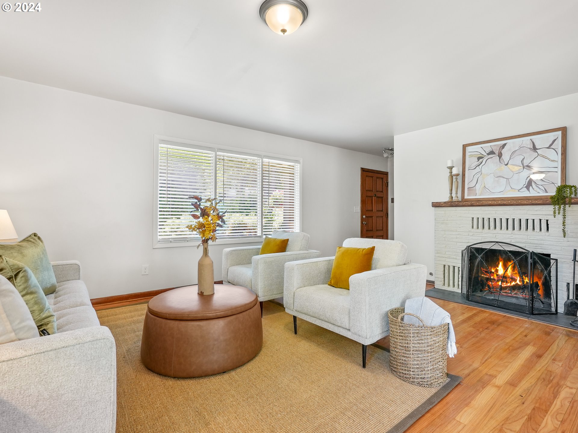 5525 Southwest Florida Street Portland, OR 97219 - Photo 9 of 44 a living room with furniture and a fireplace