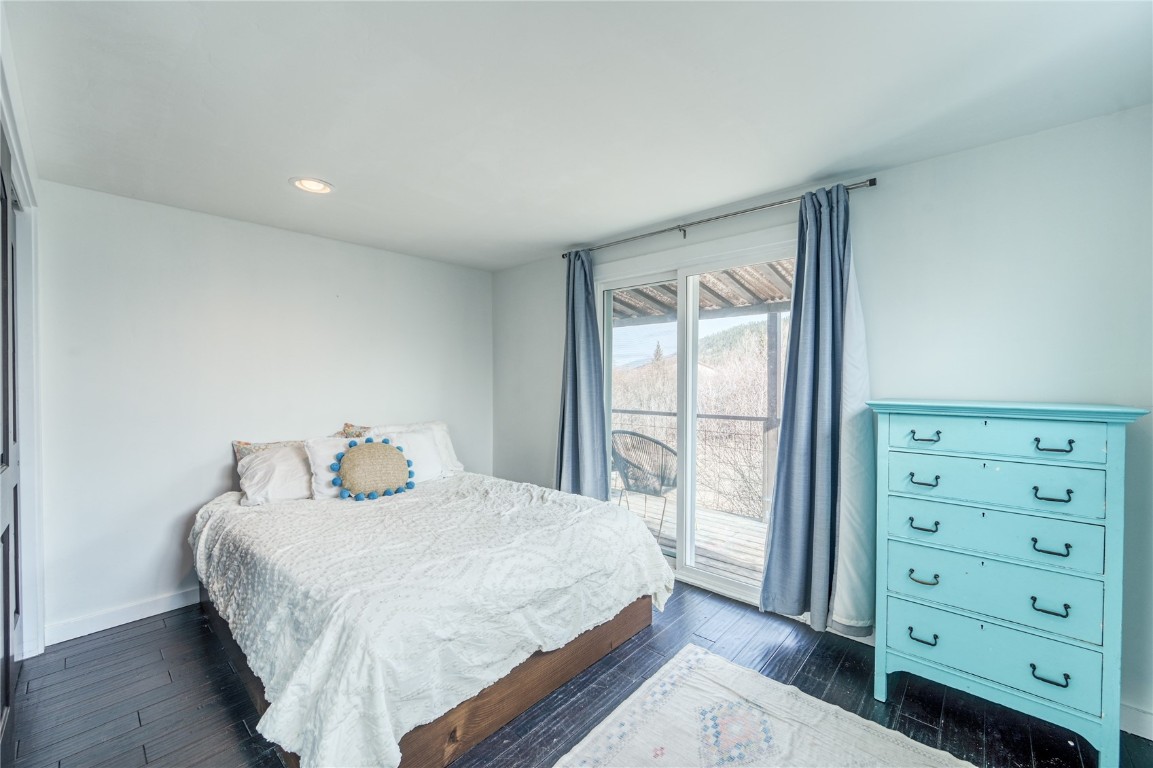 847 Airport Road, Unit 14 Breckenridge, CO 80424 - Photo 20 of 27 a bedroom with a bed and a dresser