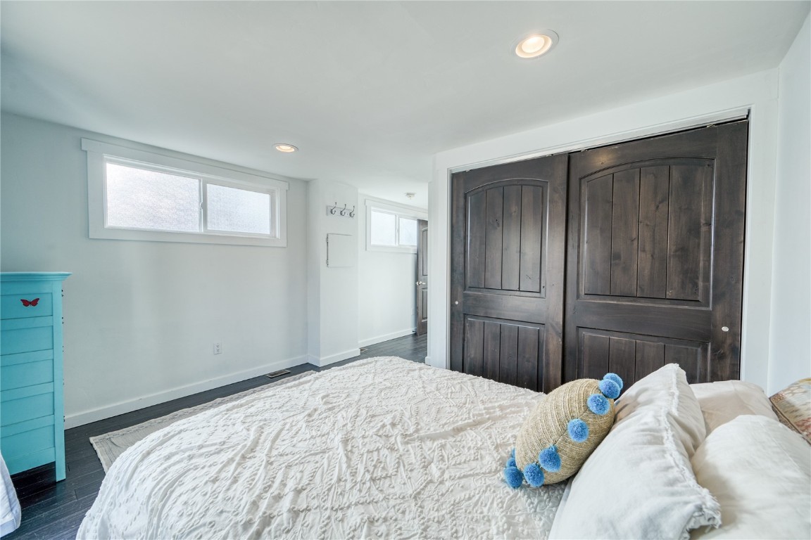 847 Airport Road, Unit 14 Breckenridge, CO 80424 - Photo 22 of 27 a bedroom with a bed and a chandelier