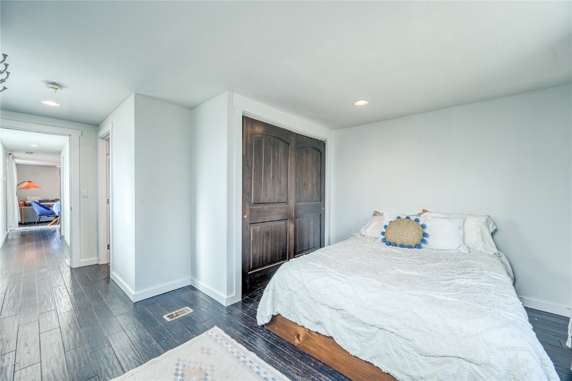 847 Airport Road, Unit 14 Breckenridge, CO 80424 - Photo 23 of 27 a bedroom with a bed and wooden floor