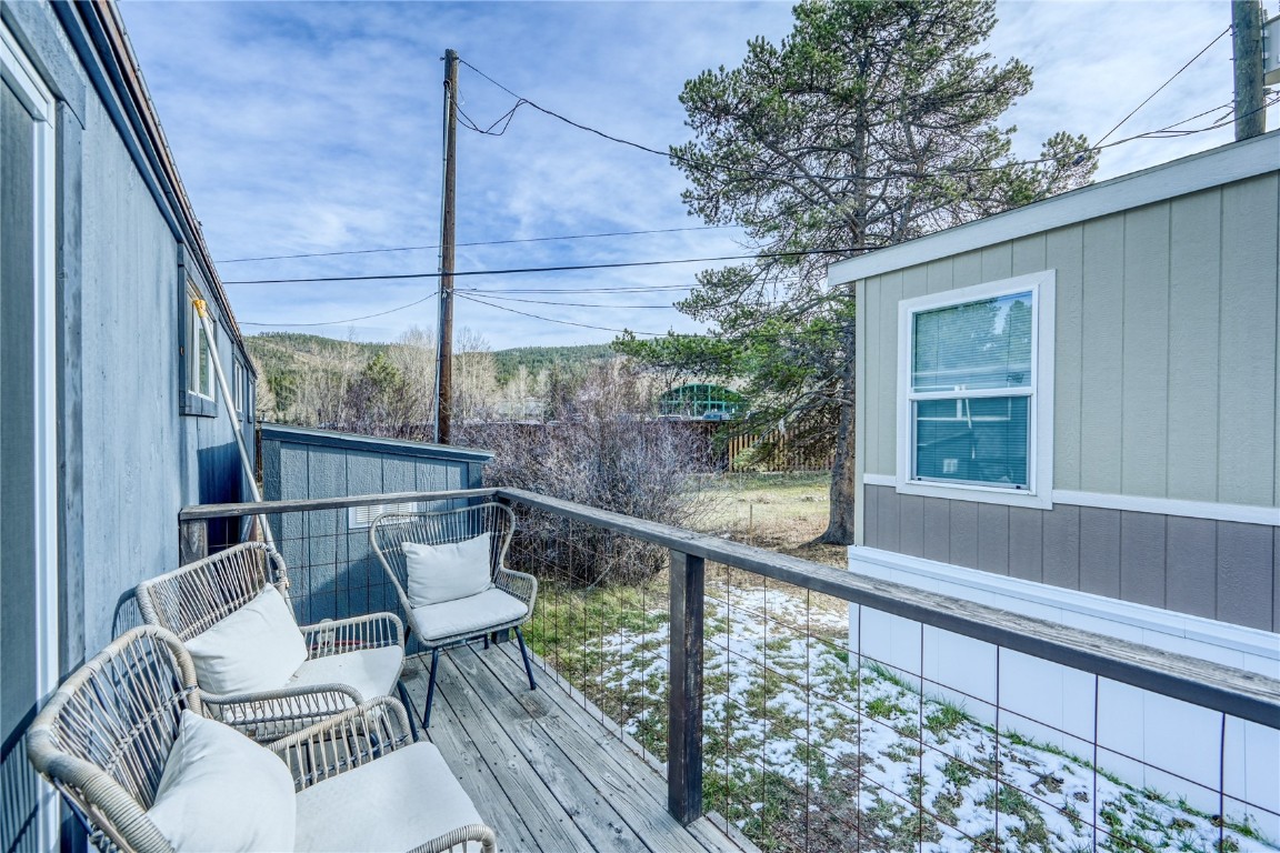 847 Airport Road, Unit 14 Breckenridge, CO 80424 - Photo 25 of 27 a view of a chair and tables in the balcony