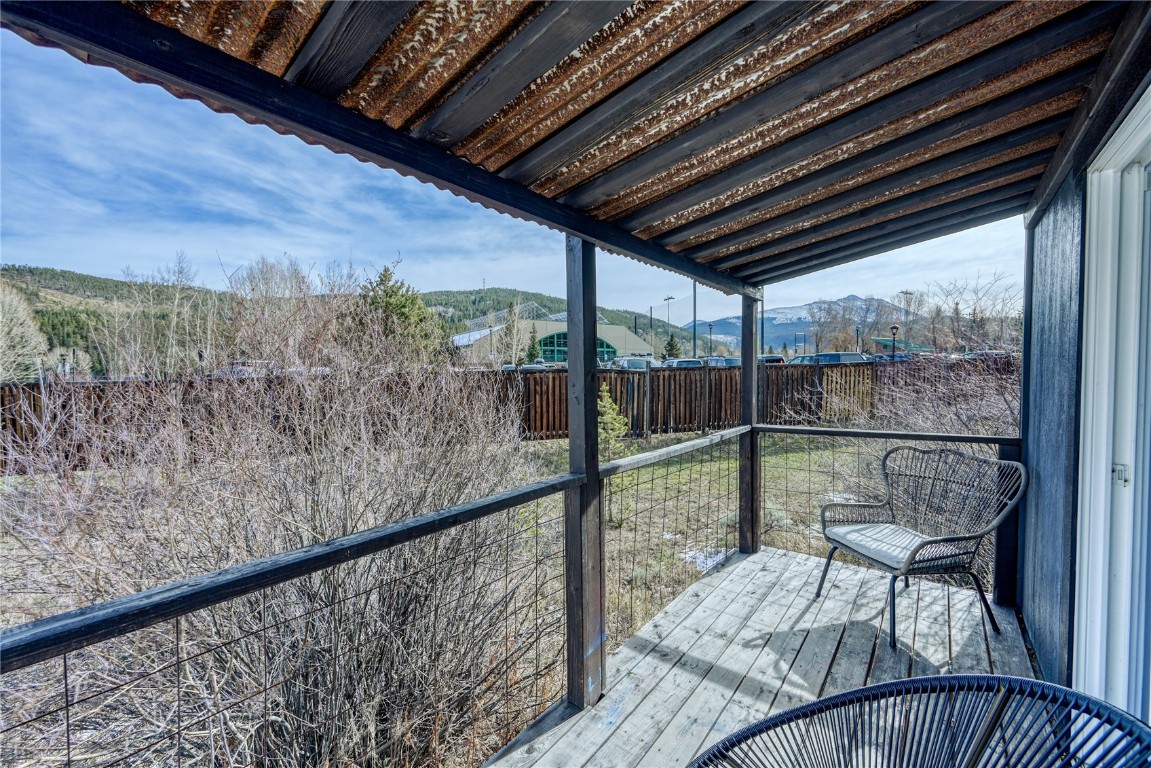 847 Airport Road, Unit 14 Breckenridge, CO 80424 - Photo 4 of 27 a view of a room with wooden floor and iron stairs