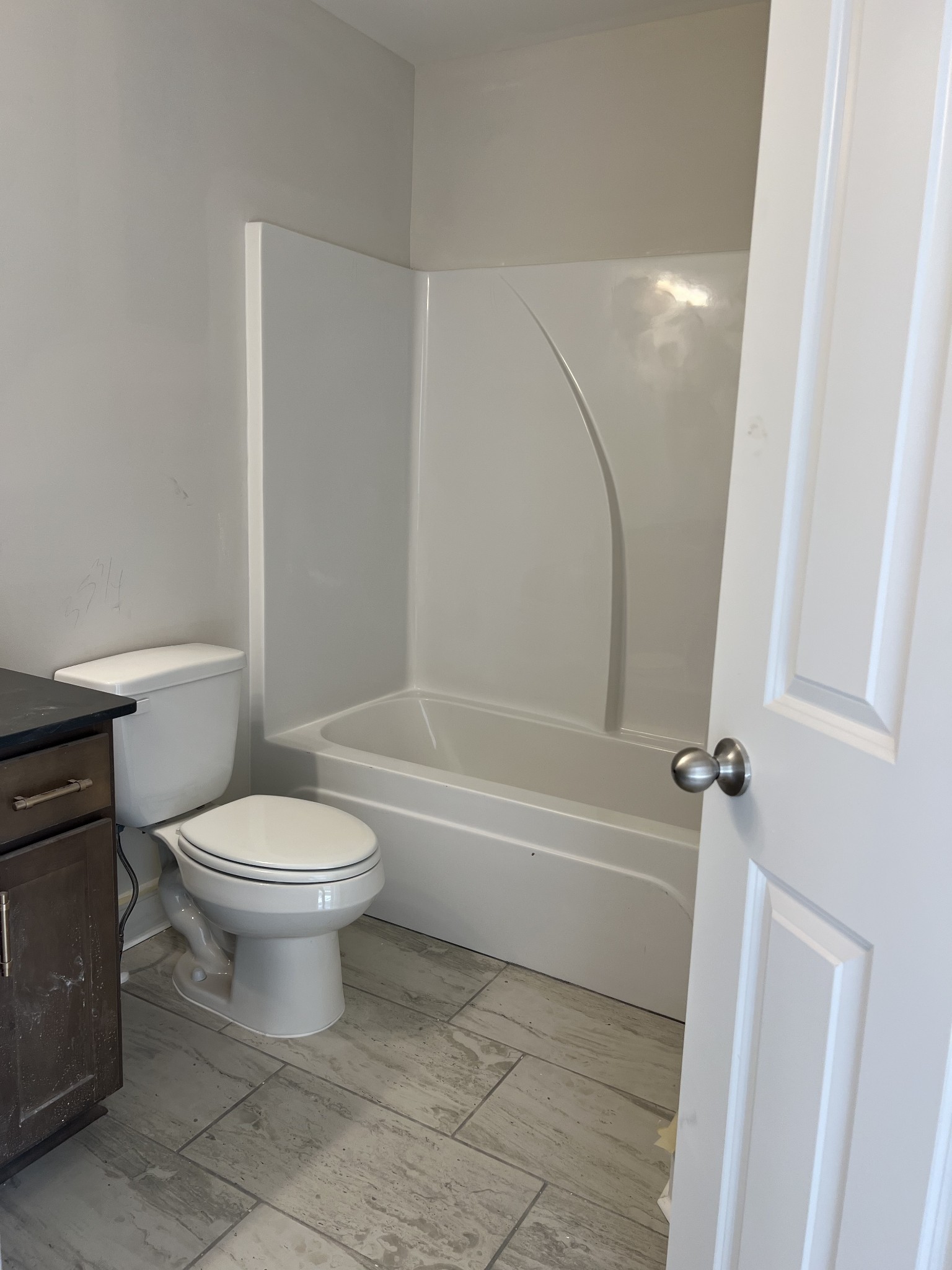 3258 Tasker Drive Antioch, TN 37013 - Photo 19 of 26 a bathroom with a toilet and a bath tub