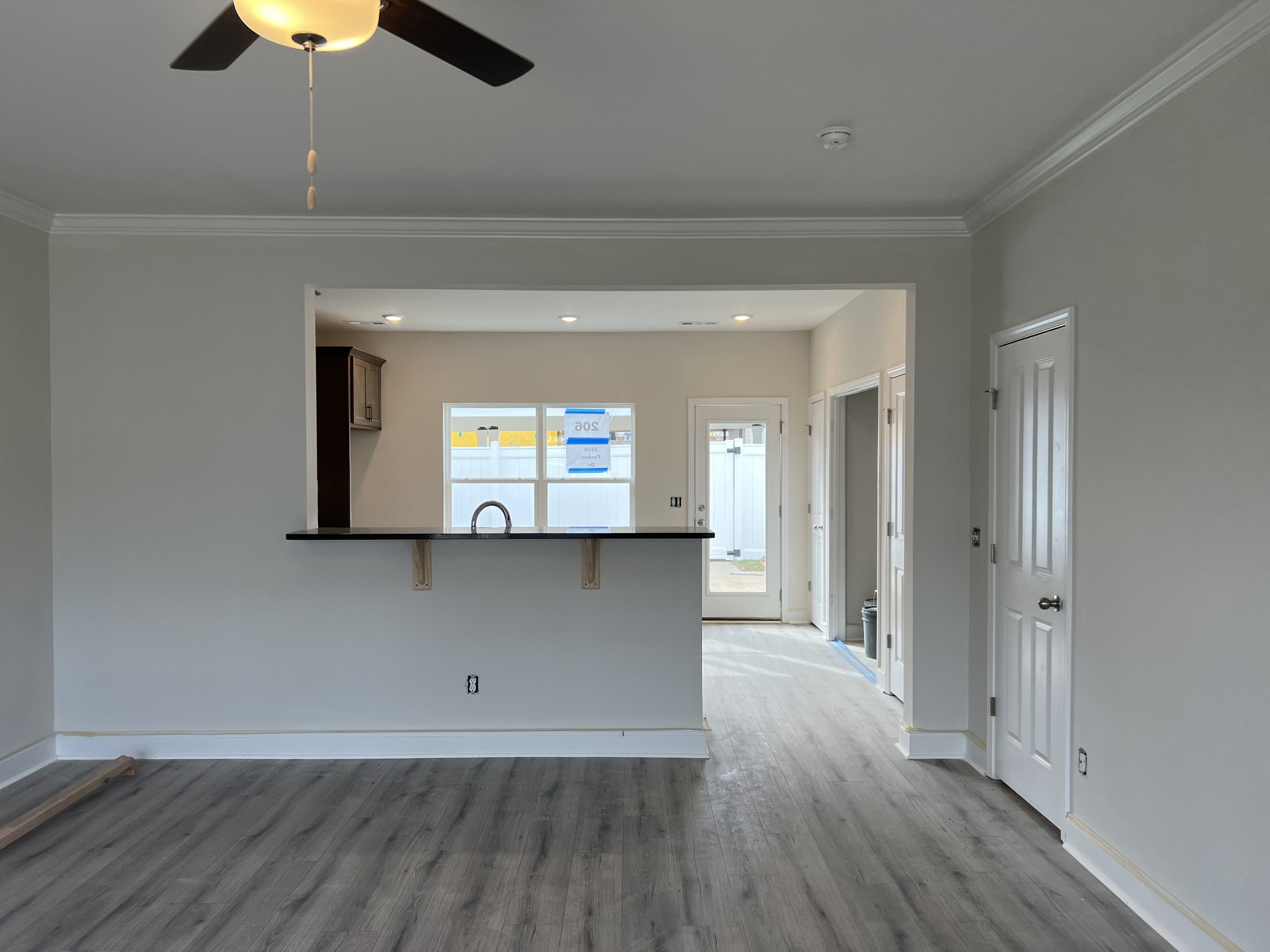 3258 Tasker Drive Antioch, TN 37013 - Photo 6 of 26 an empty room with wooden floor and chandelier fan