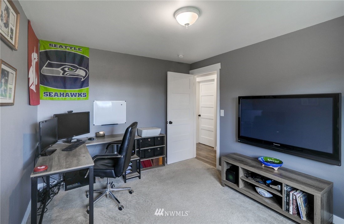 22725 2nd Place West Bothell, WA 98021 - Photo 14 of 29 a room with furniture and a flat screen tv