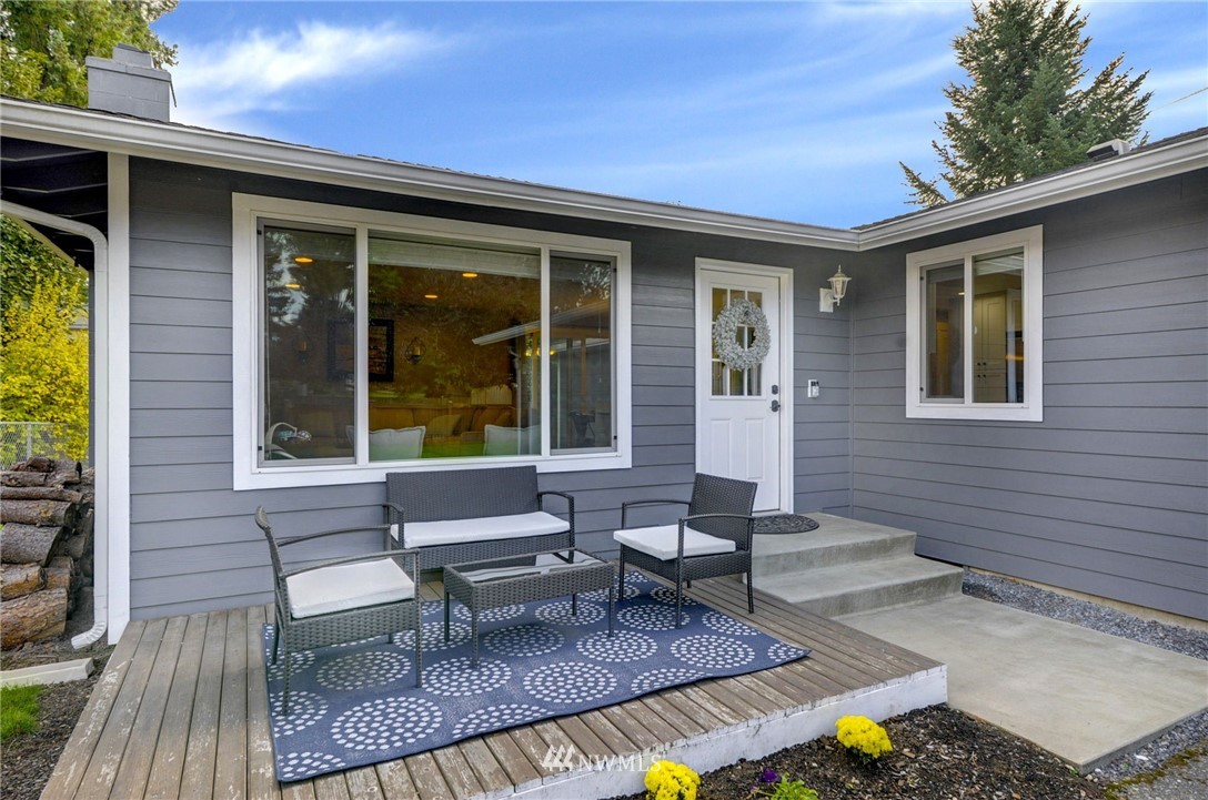 22725 2nd Place West Bothell, WA 98021 - Photo 3 of 29 a view of house with backyard outdoor seating and trees