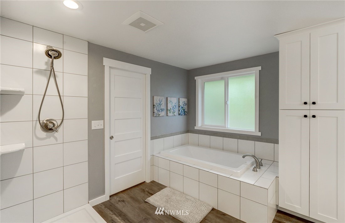22725 2nd Place West Bothell, WA 98021 - Photo 22 of 29 a bathroom with a bathtub and shower