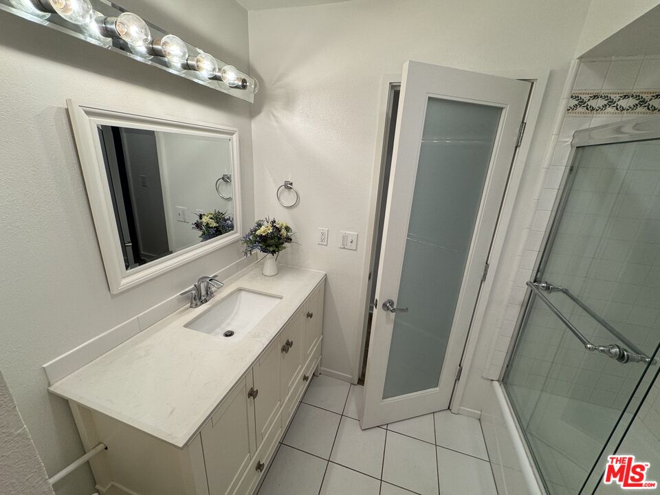 8640 Gulana Avenue, Unit K1020 Playa del Rey, CA 90293 - Photo 12 of 35 a bathroom with a double vanity sink mirror and toilet