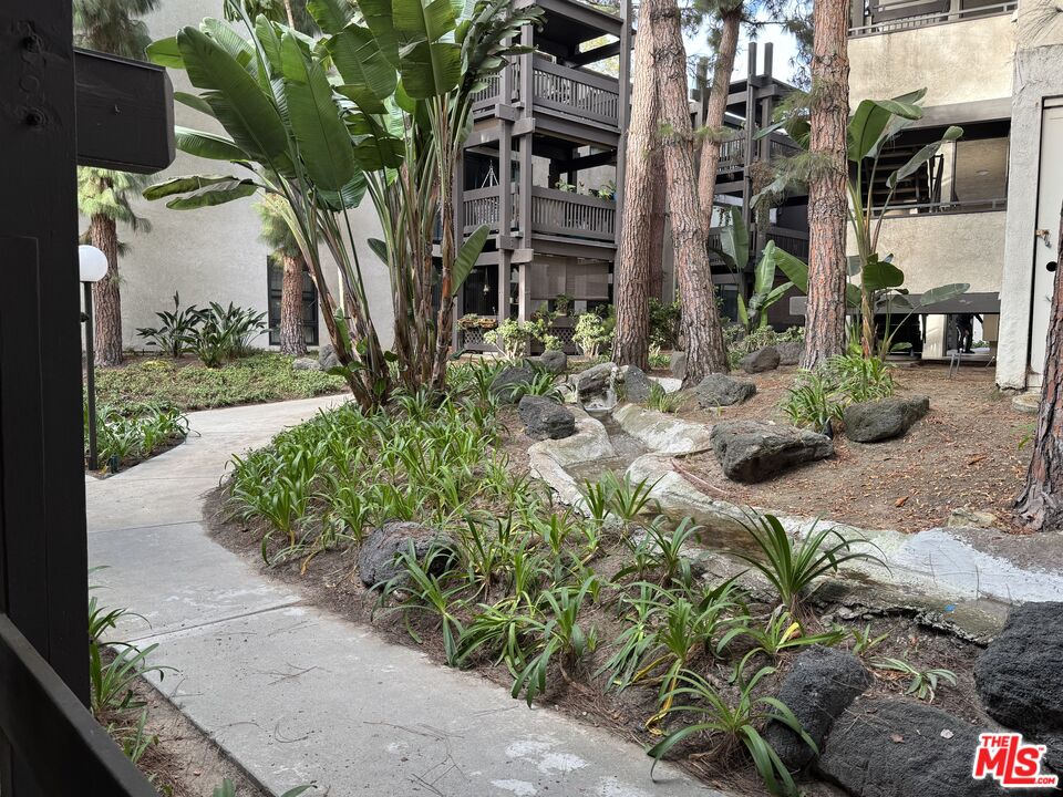 8640 Gulana Avenue, Unit K1020 Playa del Rey, CA 90293 - Photo 22 of 35 a view of a street with plants
