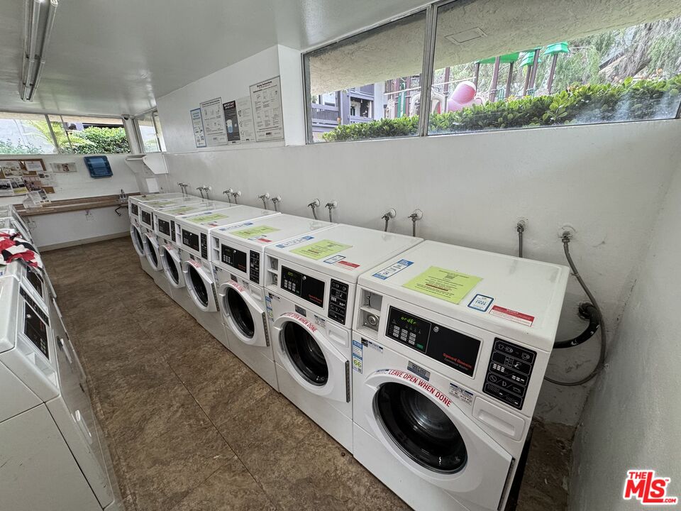8640 Gulana Avenue, Unit K1020 Playa del Rey, CA 90293 - Photo 25 of 35 a utility room with dryer and washer
