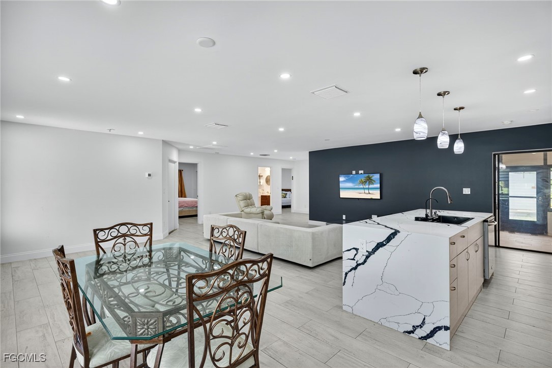 1672 Many Road North Fort Myers, FL 33903 - Photo 14 of 50 a living room with furniture and a flat screen tv
