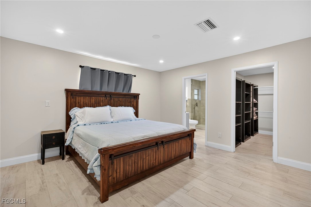 1672 Many Road North Fort Myers, FL 33903 - Photo 16 of 50 a bedroom with a bed and closet