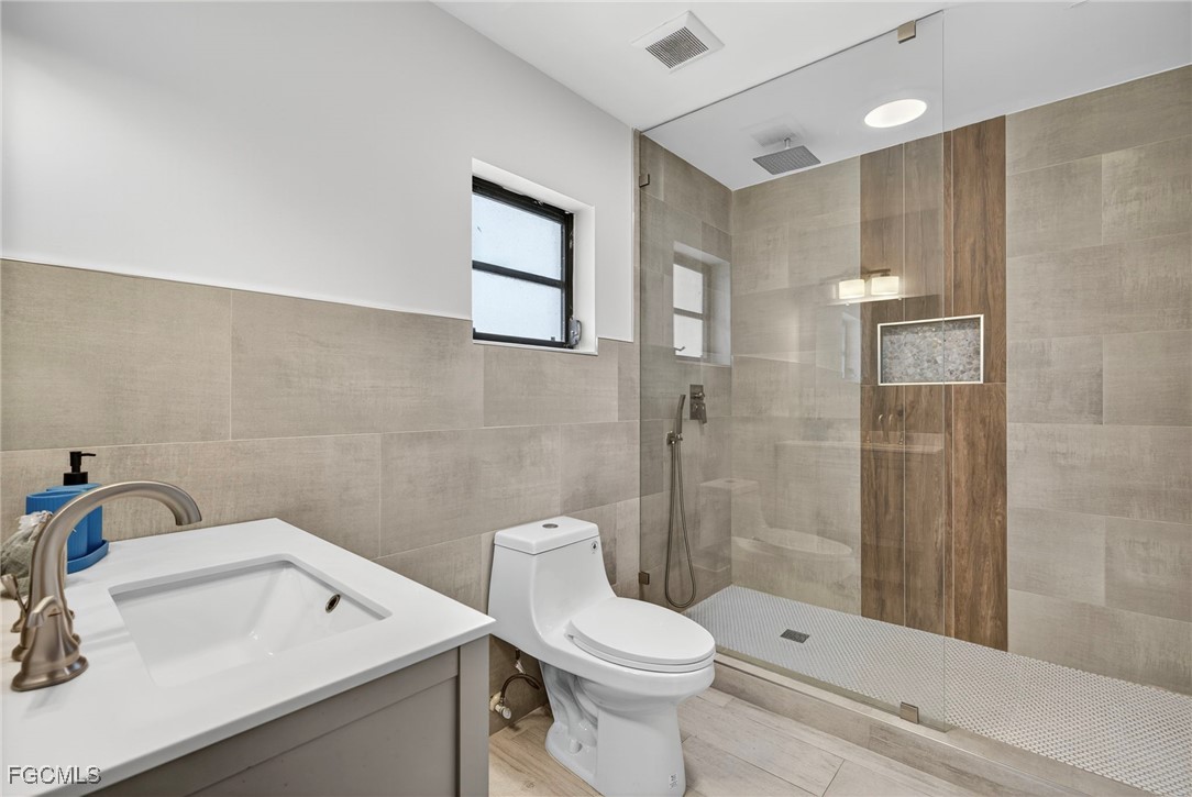 1672 Many Road North Fort Myers, FL 33903 - Photo 19 of 50 a bathroom with a sink toilet and shower