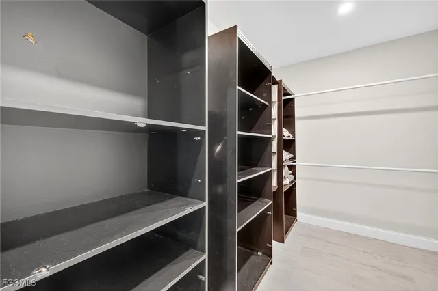 a view of an empty walk in closet