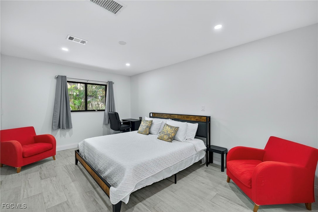 1672 Many Road North Fort Myers, FL 33903 - Photo 24 of 50 a bedroom with a bed and a couch