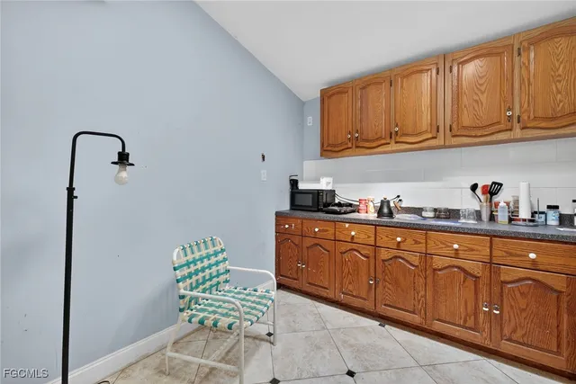 a kitchen with stainless steel appliances granite countertop a sink and cabinets