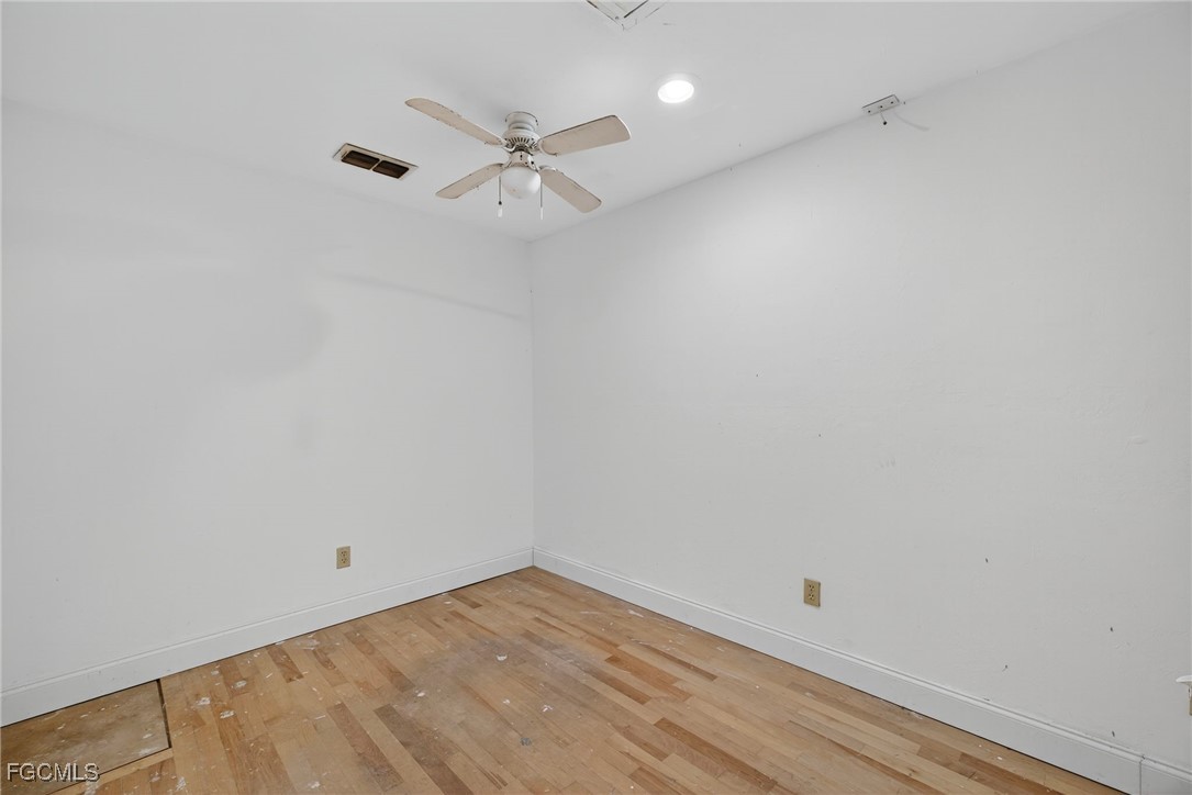1672 Many Road North Fort Myers, FL 33903 - Photo 35 of 50 wooden floor in an empty room