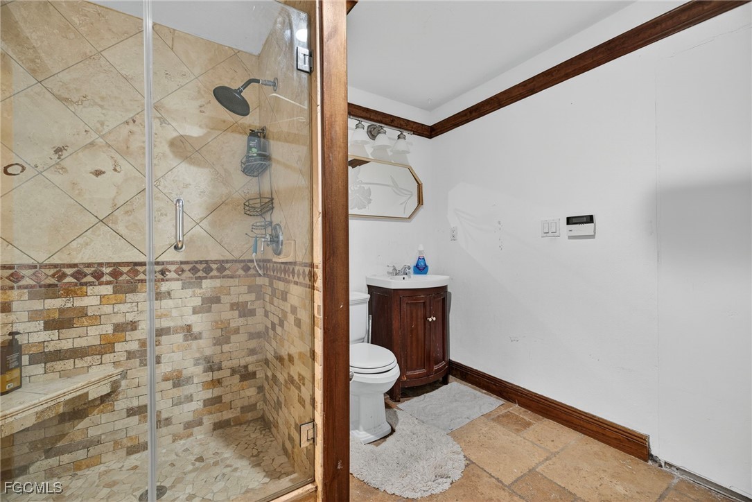 1672 Many Road North Fort Myers, FL 33903 - Photo 36 of 50 a bathroom with a shower and a toilet