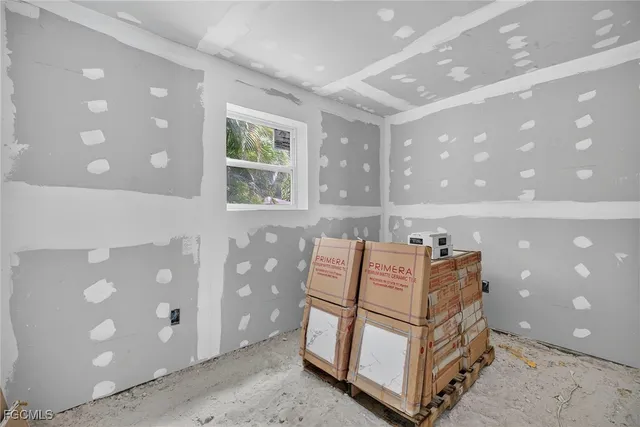 a bedroom with furniture and window