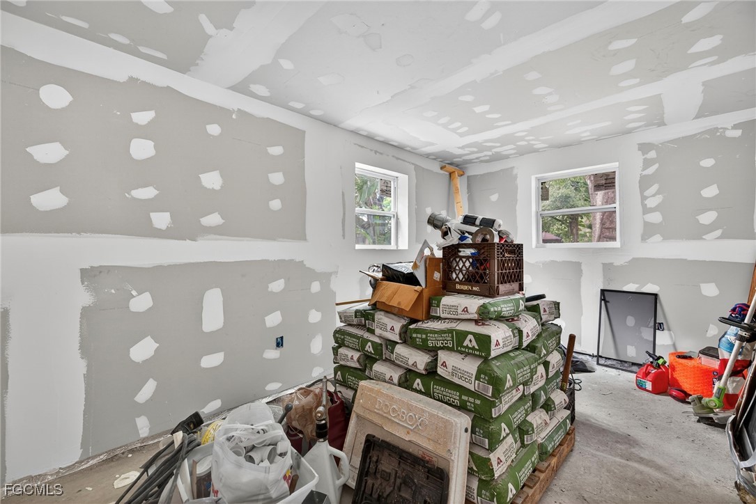 1672 Many Road North Fort Myers, FL 33903 - Photo 40 of 50 a living room with furniture and a chandelier