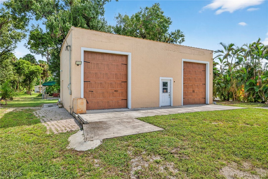 1672 Many Road North Fort Myers, FL 33903 - Photo 4 of 50 a view of a backyard with a garden