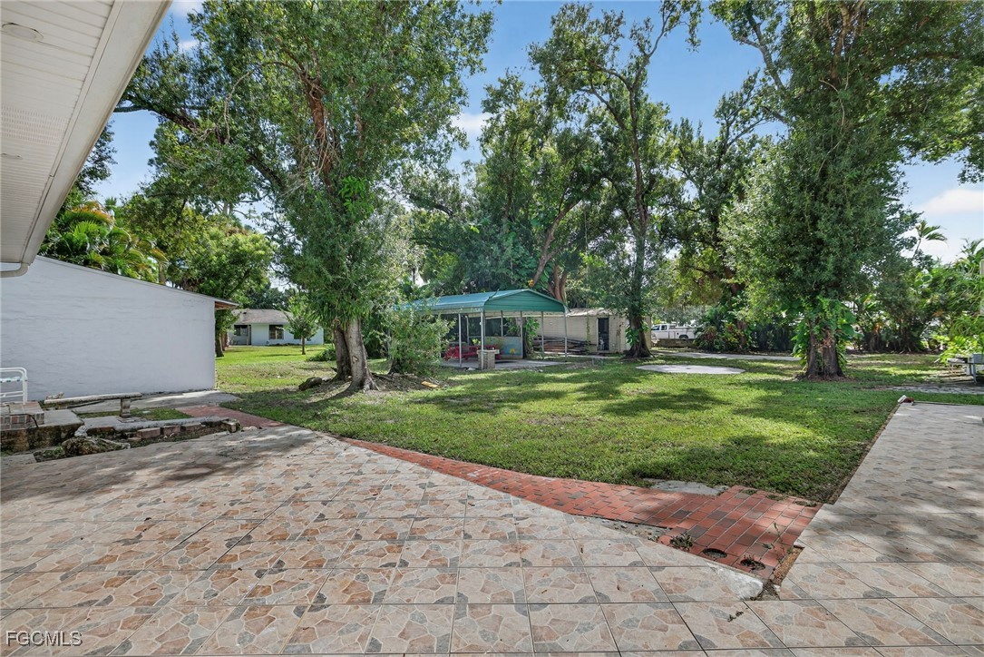 1672 Many Road North Fort Myers, FL 33903 - Photo 45 of 50 a view of a park with large trees