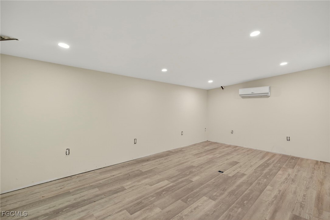 1672 Many Road North Fort Myers, FL 33903 - Photo 49 of 50 an empty room with wooden floor