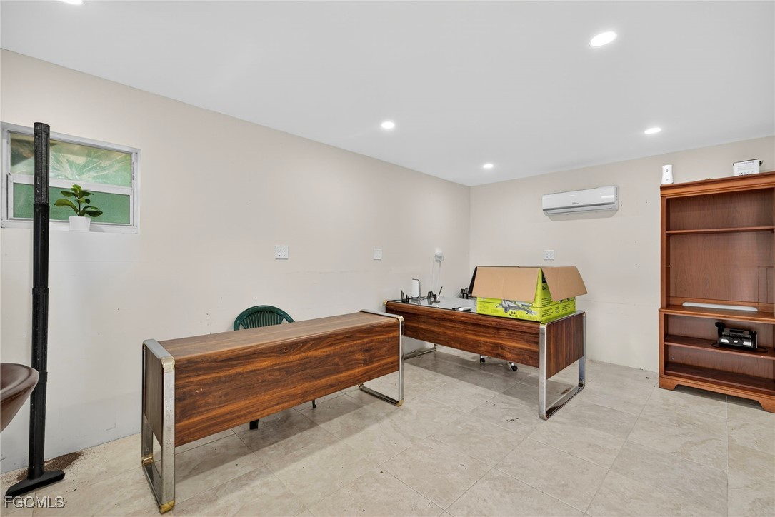 1672 Many Road North Fort Myers, FL 33903 - Photo 50 of 50 a room with furniture and a flat screen tv