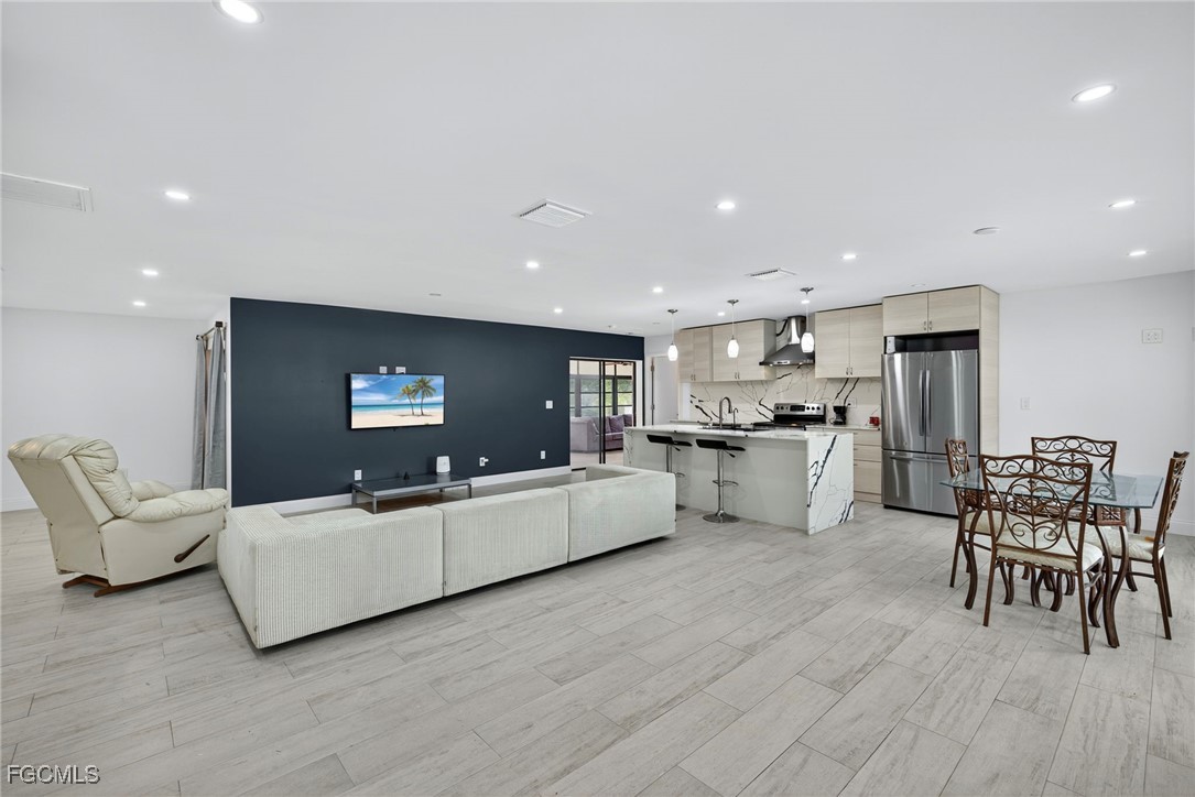 1672 Many Road North Fort Myers, FL 33903 - Photo 6 of 50 a living room with furniture and kitchen view