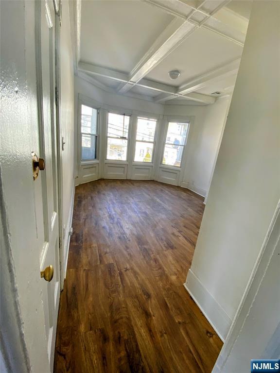 12 Hopper Street Paterson, NJ 07522 - Photo 2 of 10 a view of an empty room with wooden floor and a window