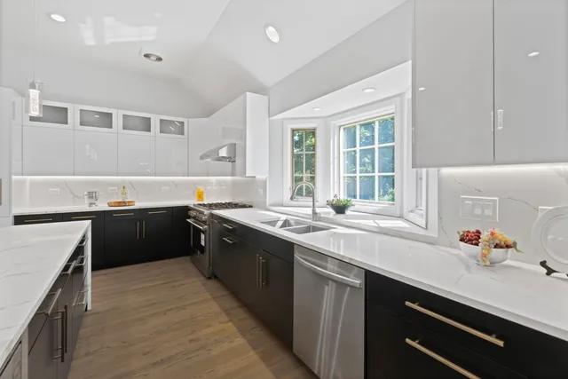 a kitchen with a sink stove and cabinets