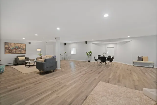 a large room with furniture and a wooden floor