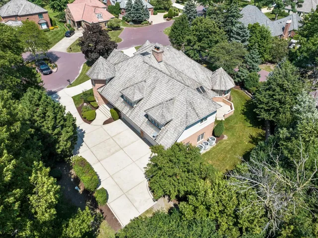 an aerial view of a house with outdoor space