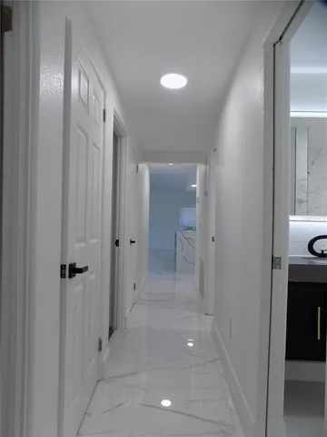 a bathroom with a shower and a sink