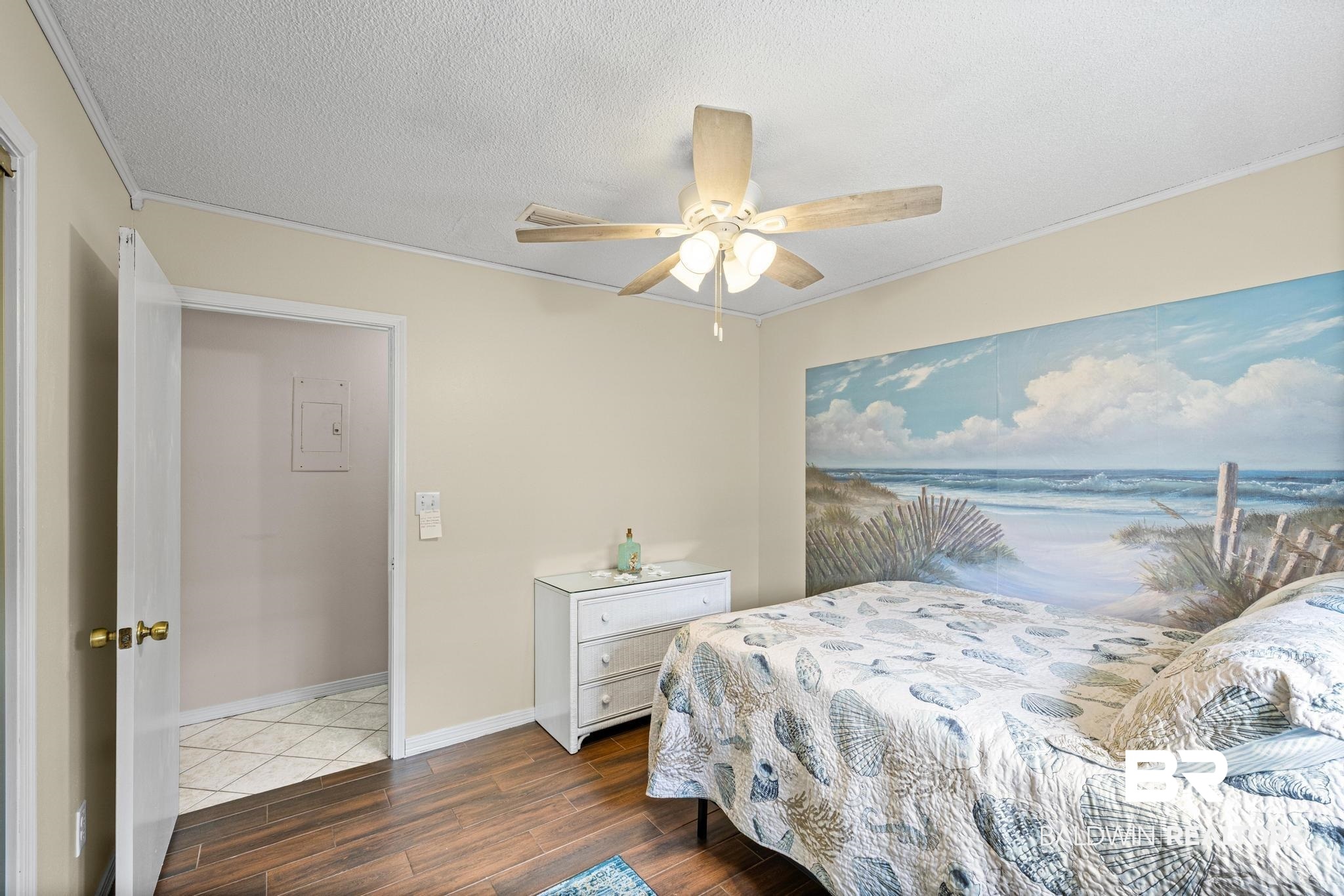 1437 Rio Circle Lillian, AL 36549 - Photo 20 of 46 Bedroom featuring dark wood finished floors, a textured ceiling, a ceiling fan, and ornamental molding