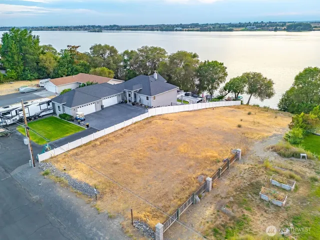 an aerial view of a house with a lake view