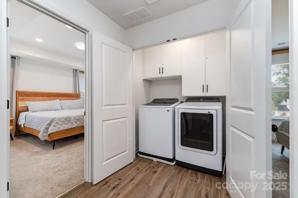 a kitchen with stainless steel appliances a stove a microwave and a refrigerator