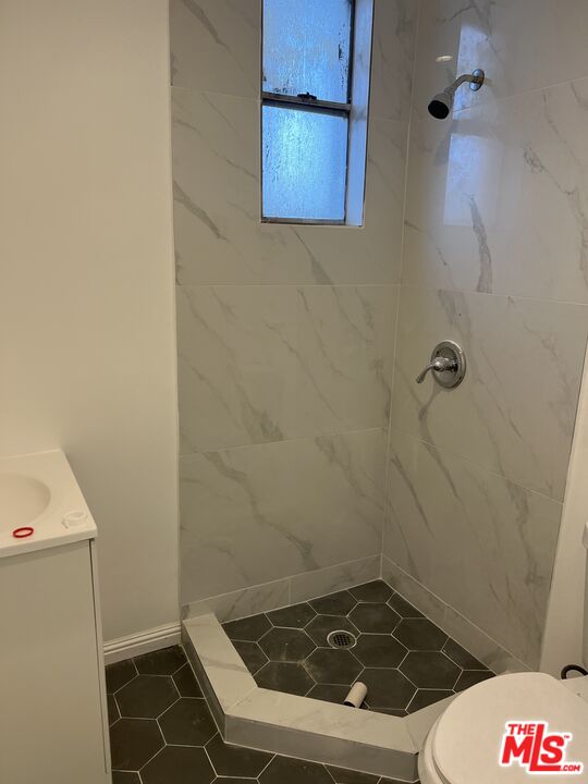 1009 West 46th Street Los Angeles, CA 90037 - Photo 3 of 3 a bathroom with a sink and toilet