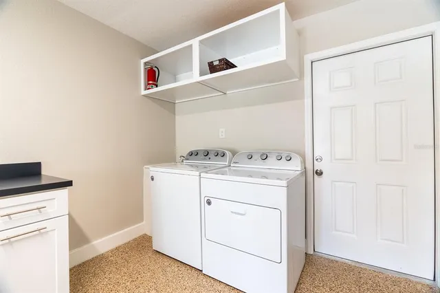 a utility room with dryer and washer