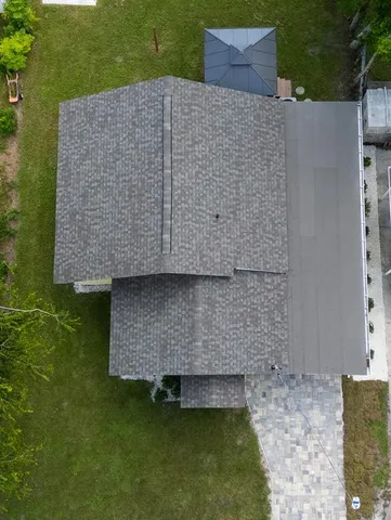 an aerial view of a house with a garden