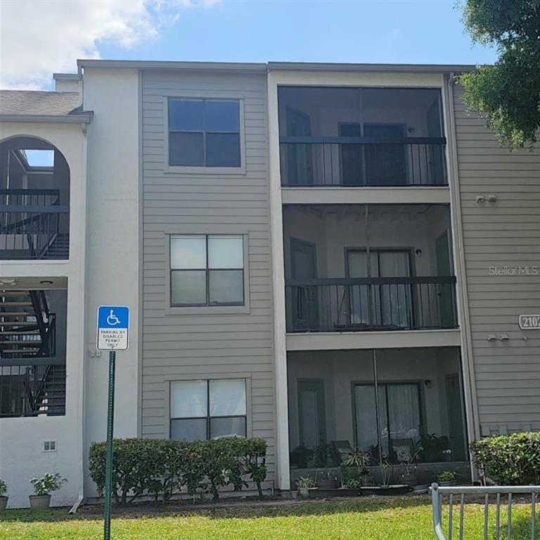 a front view of a house with yard and garage