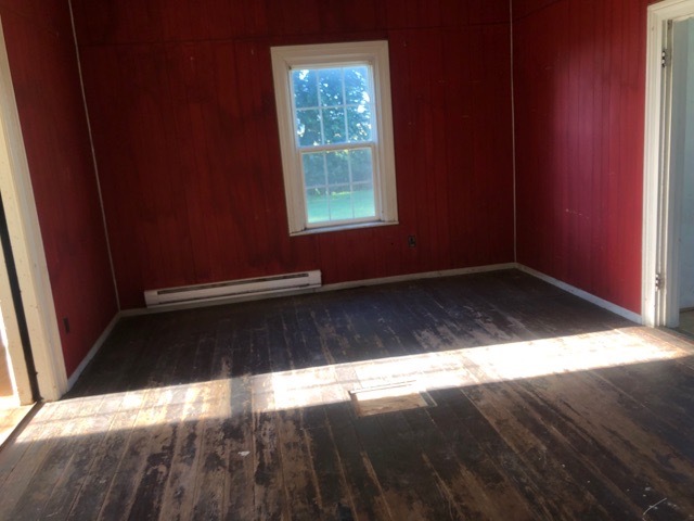 6802 North Quarry Road Warren, IL 61087 - Photo 4 of 21 a view of empty room with wooden floor and fan