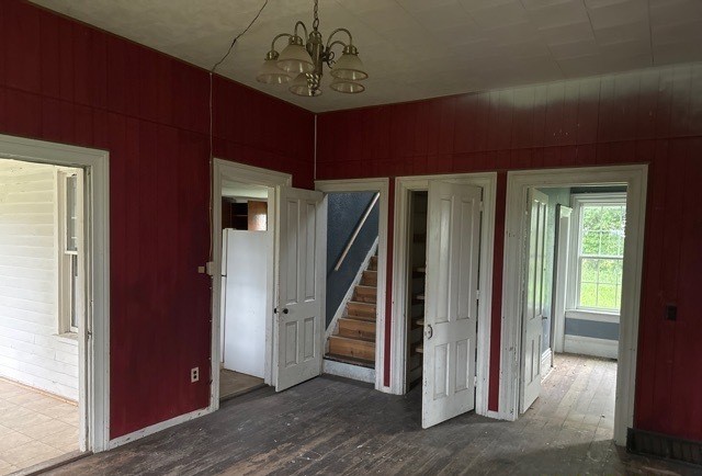 6802 North Quarry Road Warren, IL 61087 - Photo 5 of 21 a view of a livingroom with wooden floor and stairs