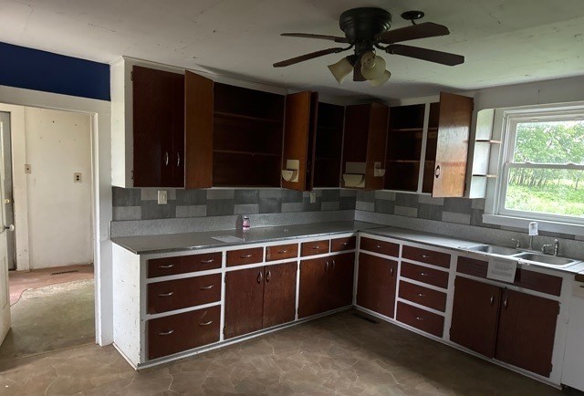 6802 North Quarry Road Warren, IL 61087 - Photo 6 of 21 a kitchen with stainless steel appliances granite countertop a sink and a stove