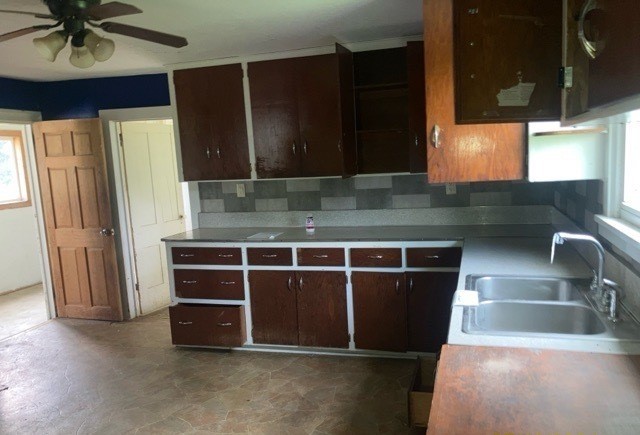 6802 North Quarry Road Warren, IL 61087 - Photo 8 of 21 a kitchen with stainless steel appliances kitchen island granite countertop a refrigerator and a sink
