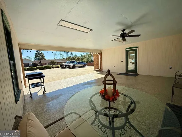 a kitchen with stainless steel appliances granite countertop a sink refrigerator and cabinets