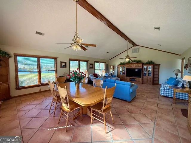 a bed room with a bed and a chandelier